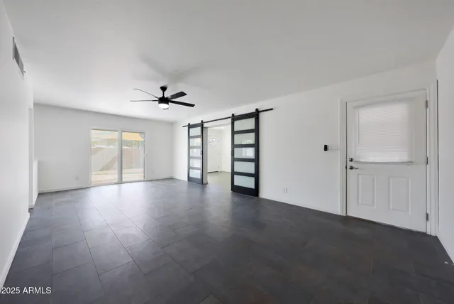 a view of an empty room with a window