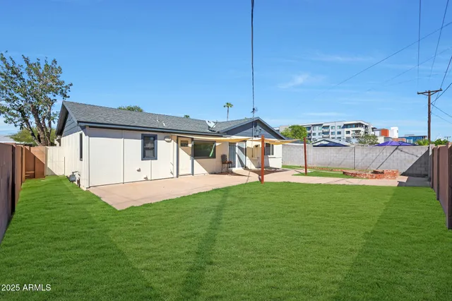 a house view with a sitting space and garden