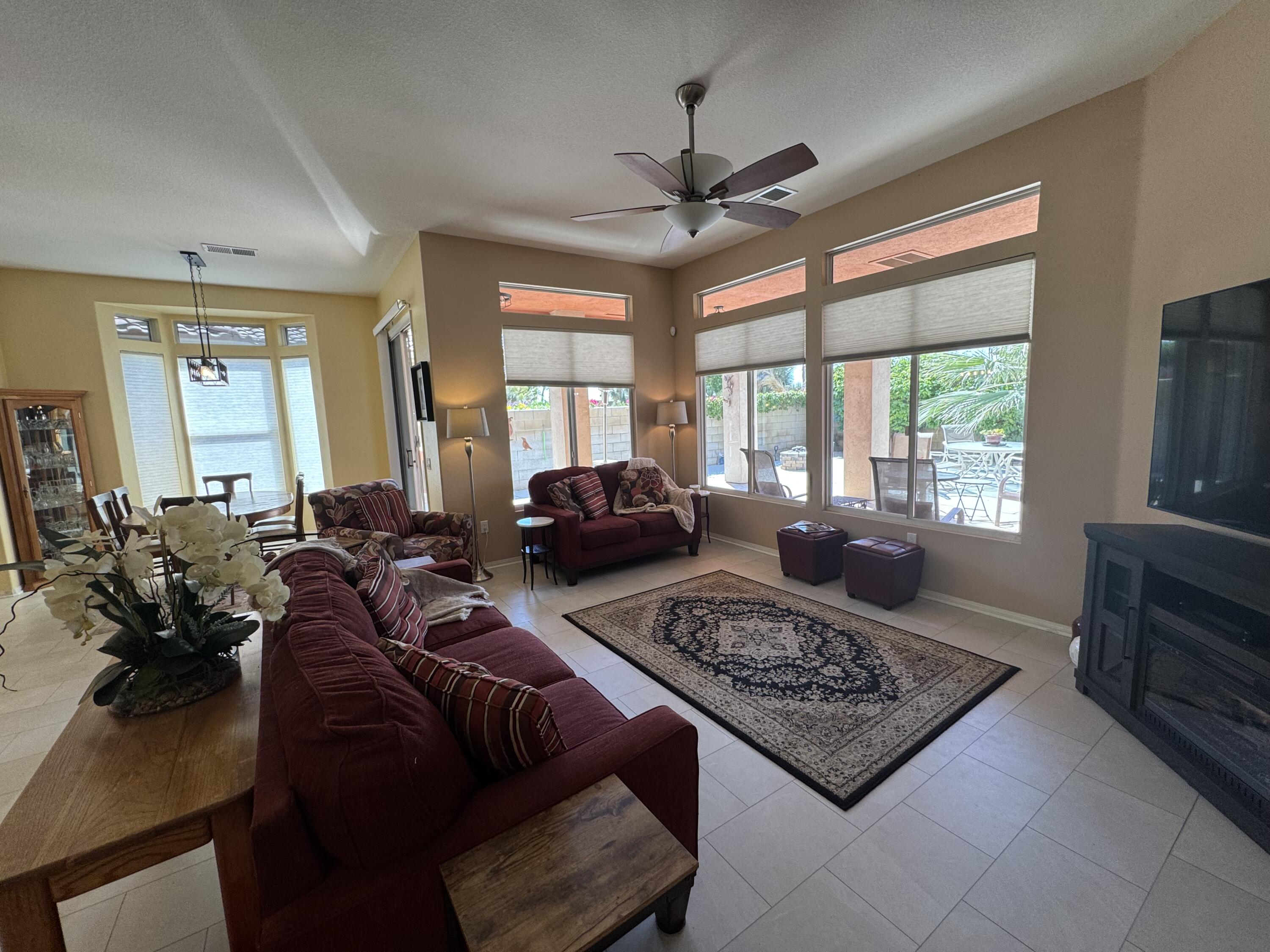 44414 Royal Lytham Drive Indio, CA 92201 - Photo 11 of 47 a living room with furniture windows and a flat screen tv