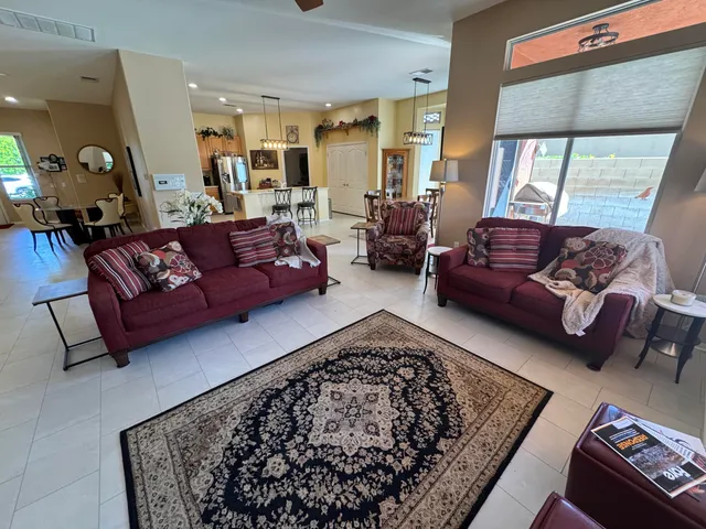 a living room with furniture and a rug