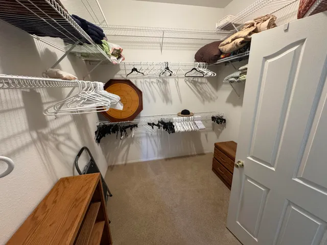 a view of storage and utility room with racks on the wall