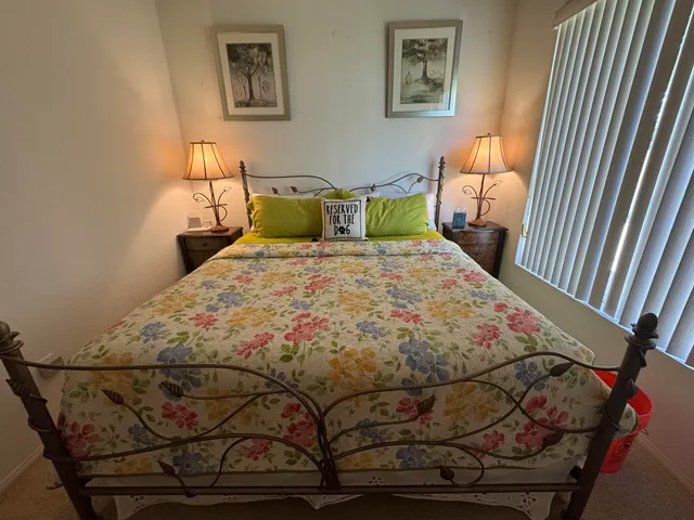 a bedroom with a bed and chair