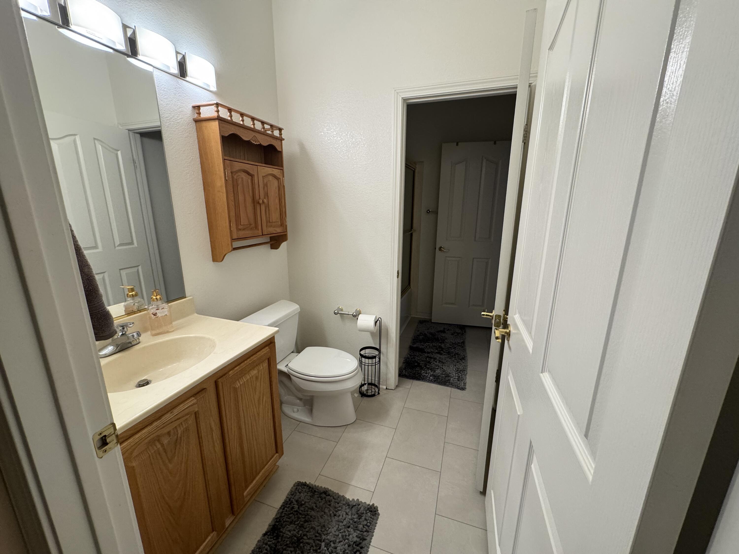 44414 Royal Lytham Drive Indio, CA 92201 - Photo 26 of 47 a bathroom with a sink and a mirror