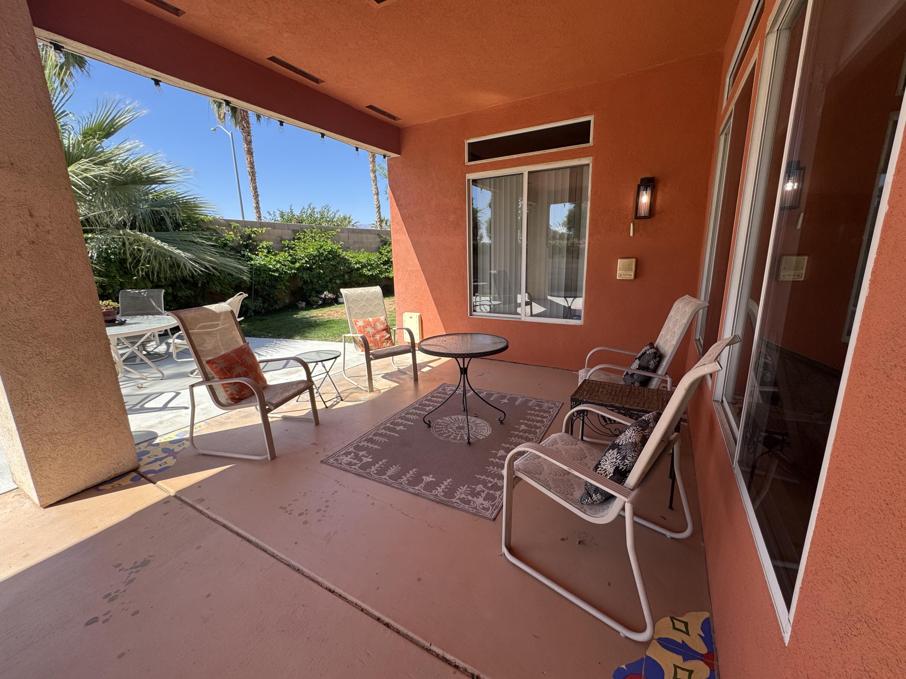 44414 Royal Lytham Drive Indio, CA 92201 - Photo 29 of 47 a couple of chairs sitting in patio of a house