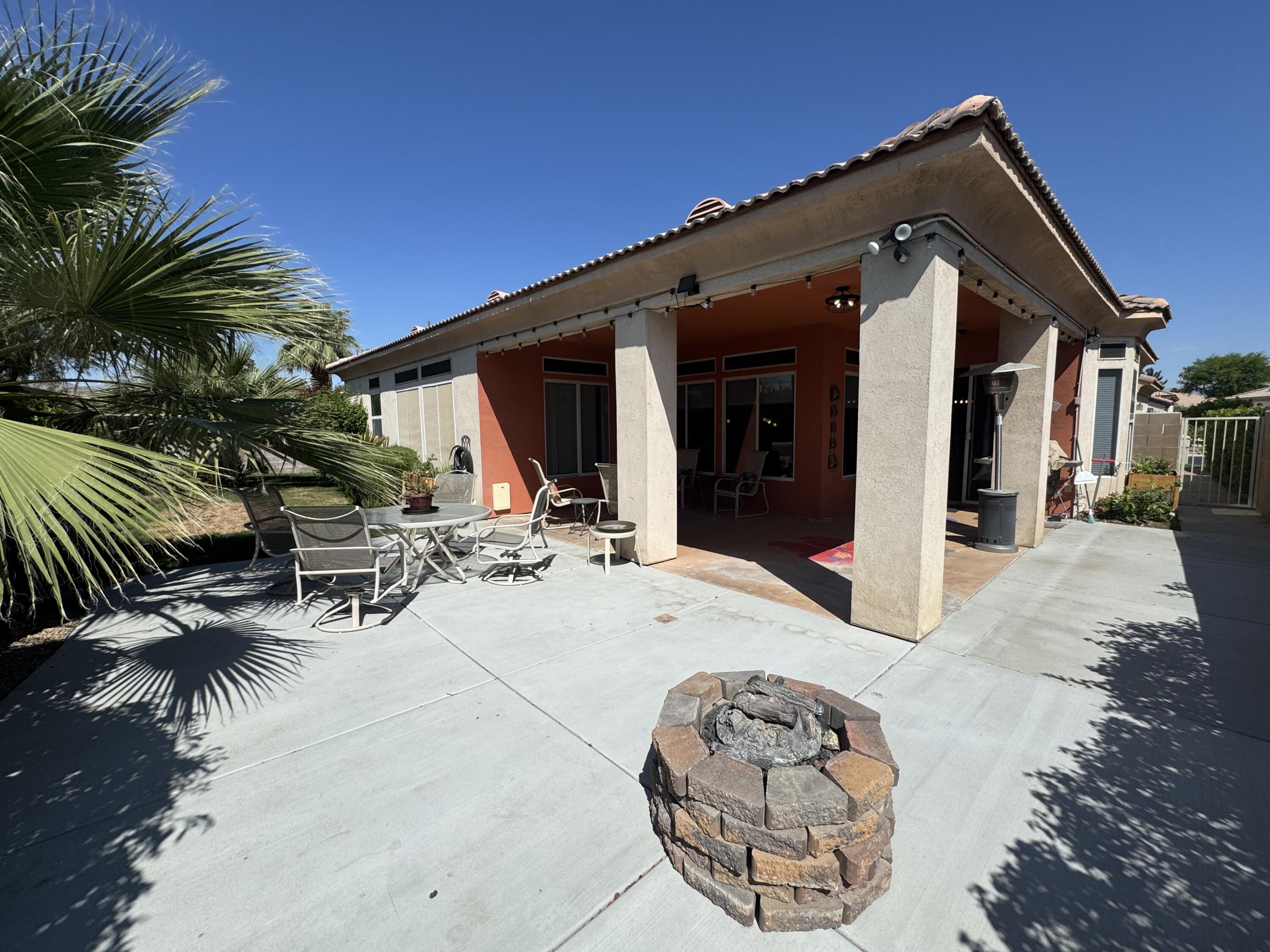 44414 Royal Lytham Drive Indio, CA 92201 - Photo 31 of 47 a view of a dinning table and chairs in patio