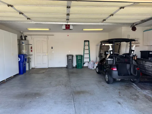 an aerial view of a house with garden space and street view
