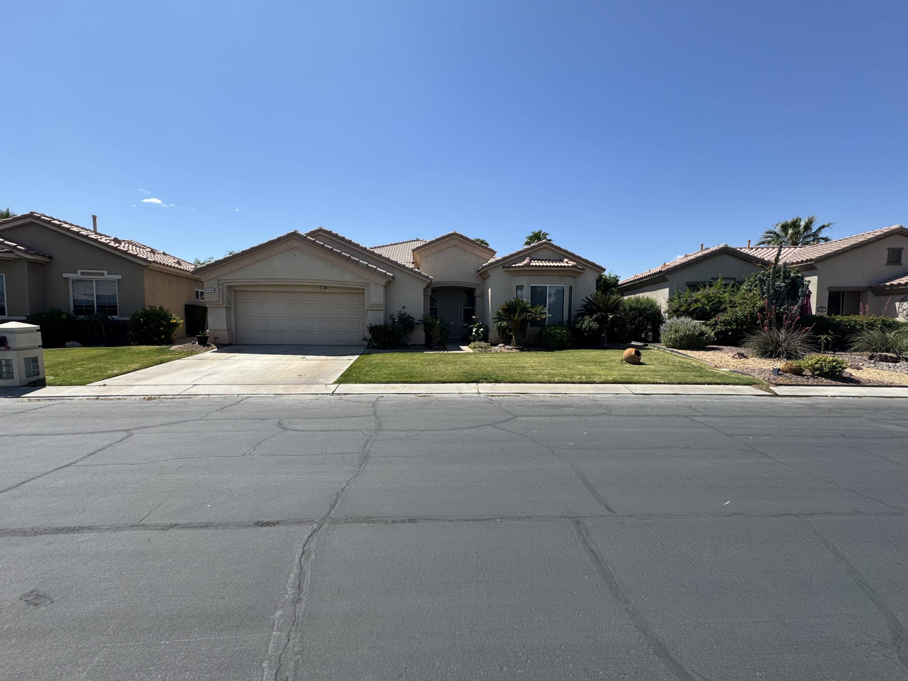 44414 Royal Lytham Drive Indio, CA 92201 - Photo 37 of 47 a front view of a house with a yard
