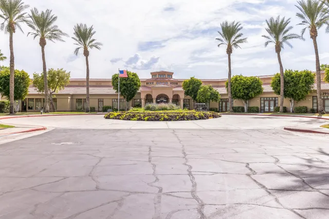 a very nice looking living room with furniture and a large window