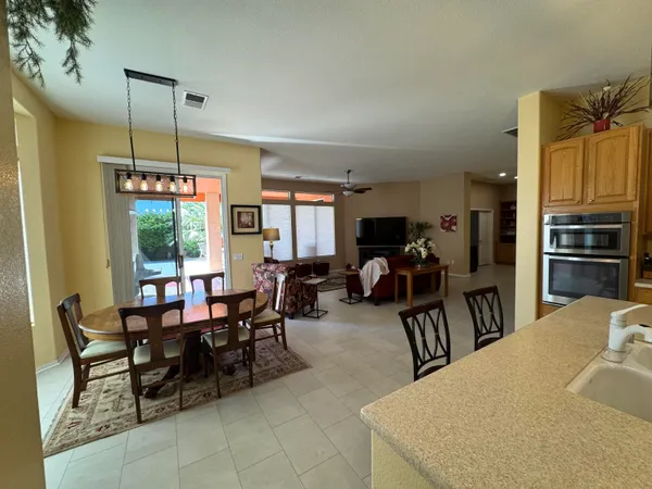 a view of a dining room with furniture window and outside view