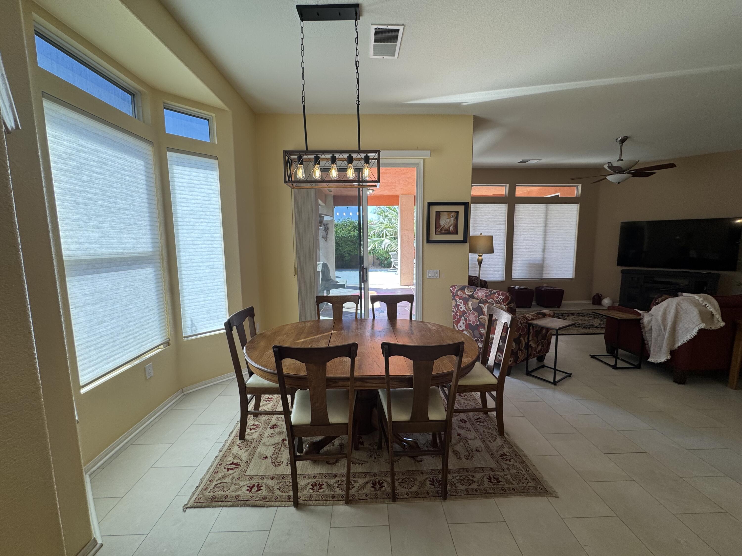 44414 Royal Lytham Drive Indio, CA 92201 - Photo 8 of 47 a view of a dining room with furniture window and outside view