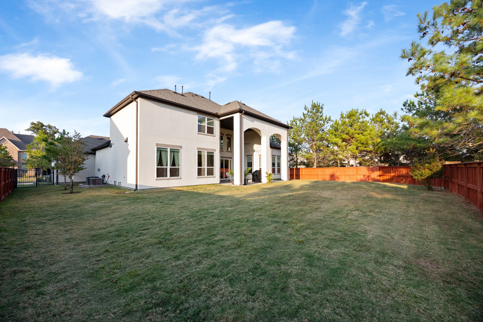 8538 Tynan Ridge Drive Magnolia, TX 77354 - Photo 13 of 50 a view of a house with a big yard potted plants and large tree