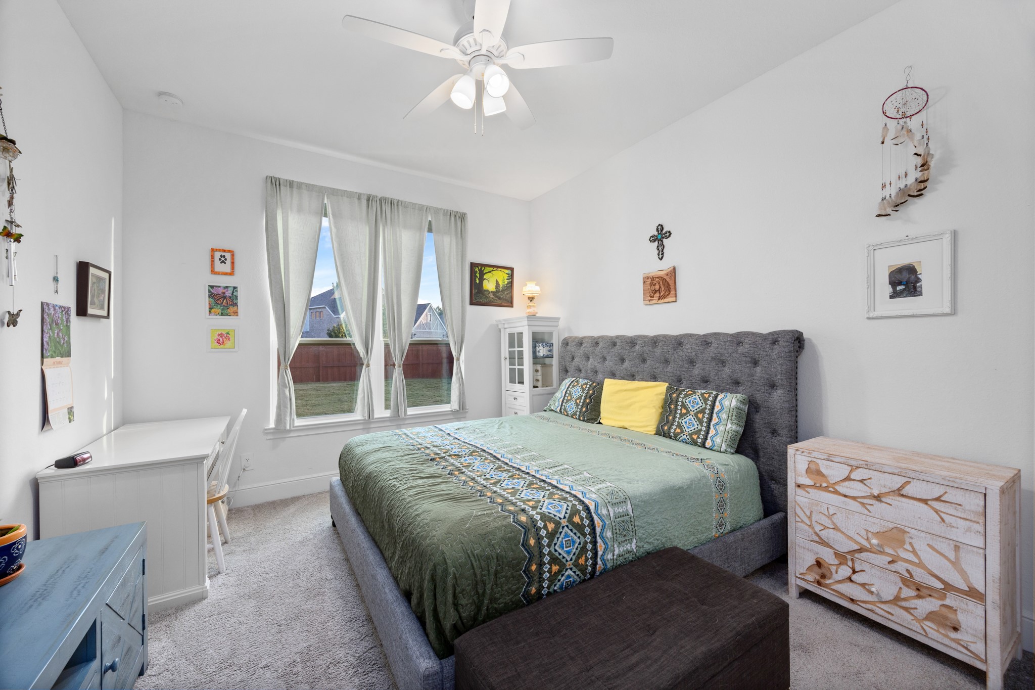 8538 Tynan Ridge Drive Magnolia, TX 77354 - Photo 15 of 50 a bedroom with a bed and a chandelier