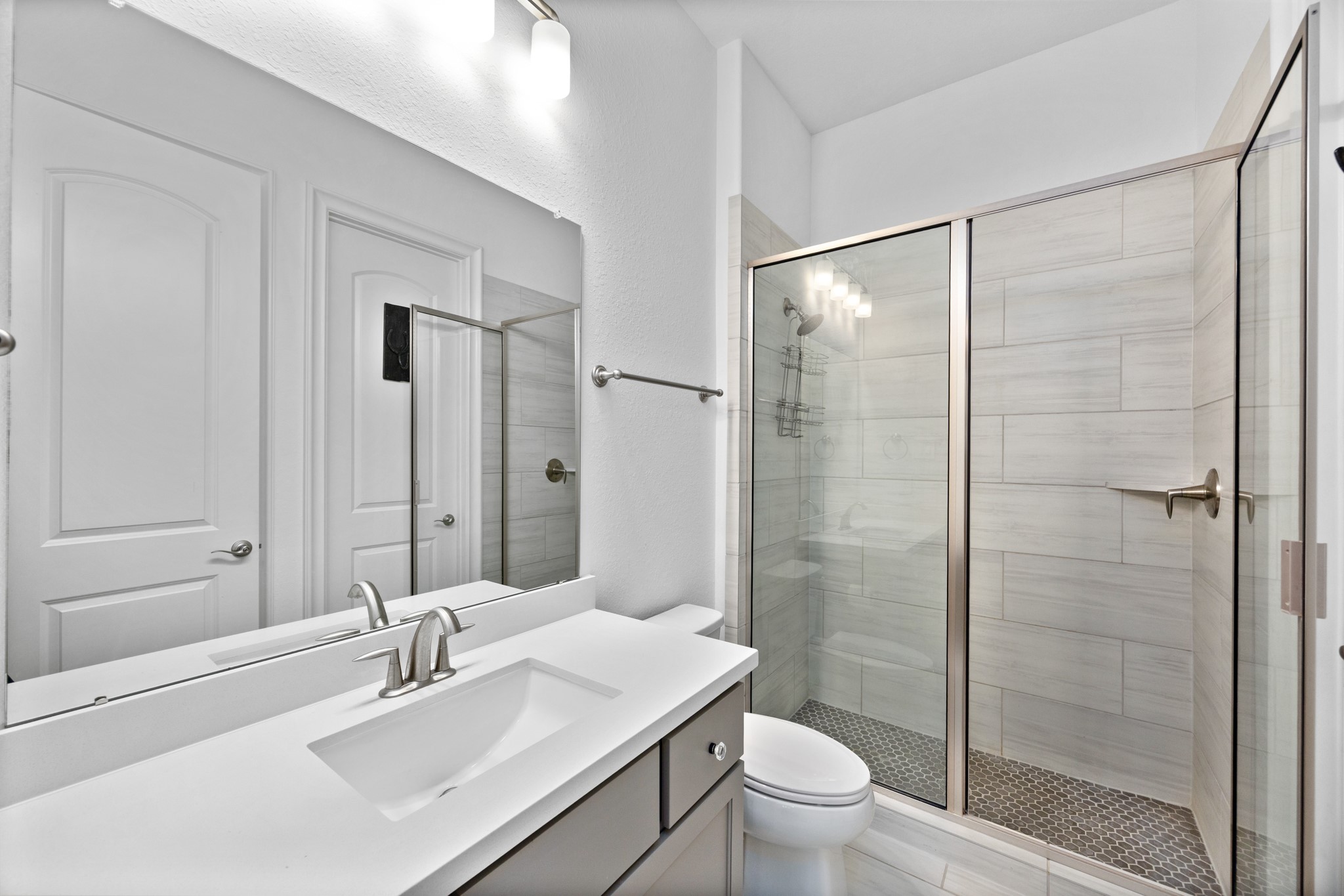 8538 Tynan Ridge Drive Magnolia, TX 77354 - Photo 16 of 50 a bathroom with a sink toilet and shower