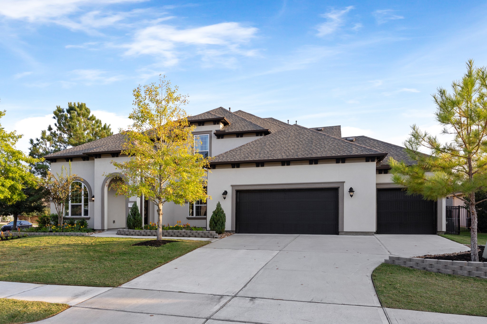 8538 Tynan Ridge Drive Magnolia, TX 77354 - Photo 2 of 50 a front view of a house with a yard and garage
