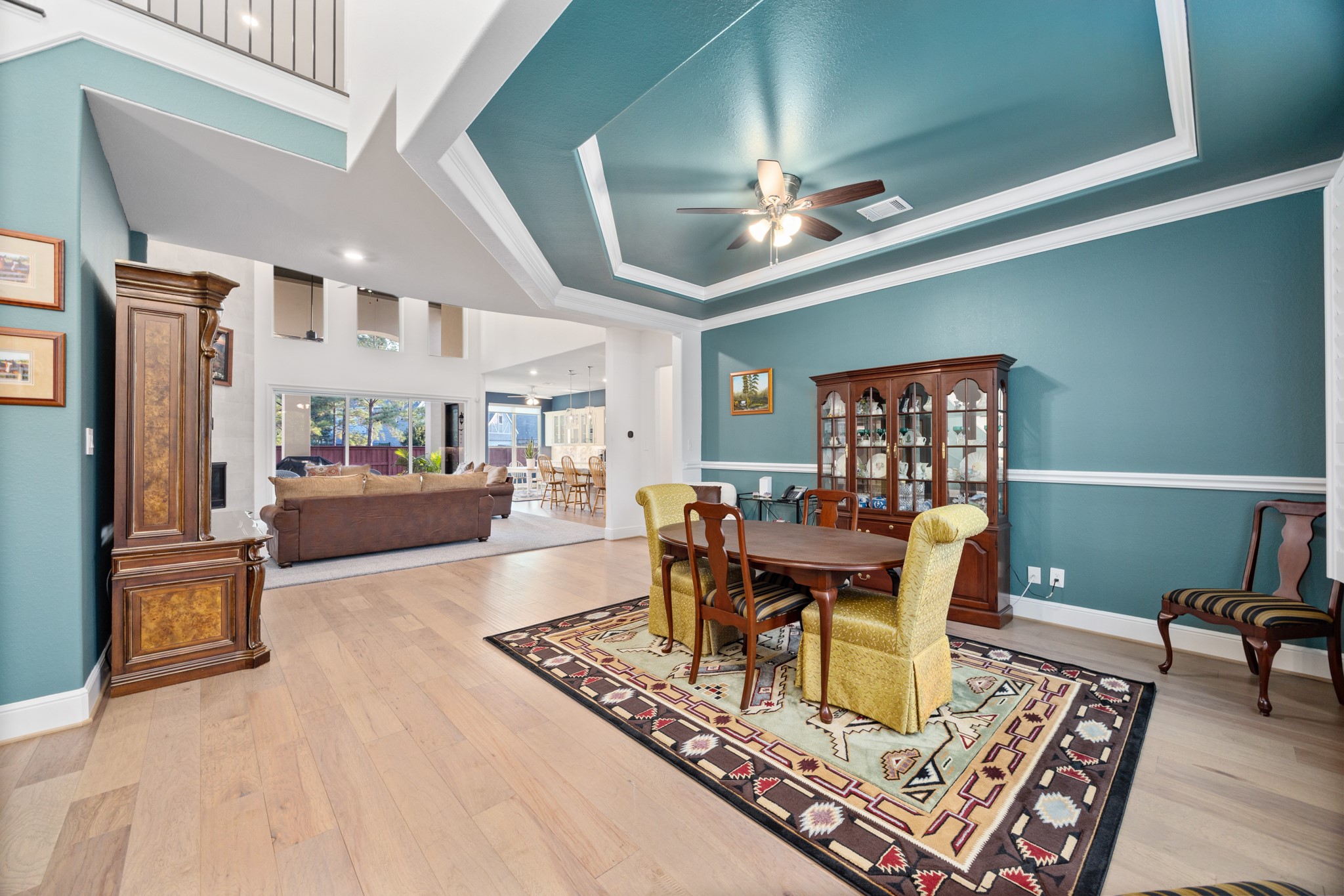 8538 Tynan Ridge Drive Magnolia, TX 77354 - Photo 21 of 50 a living room with furniture and a chandelier