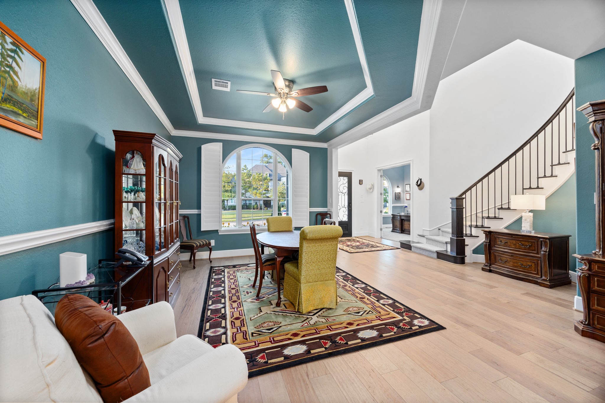 8538 Tynan Ridge Drive Magnolia, TX 77354 - Photo 23 of 50 a living room with furniture and a dining table with wooden floor