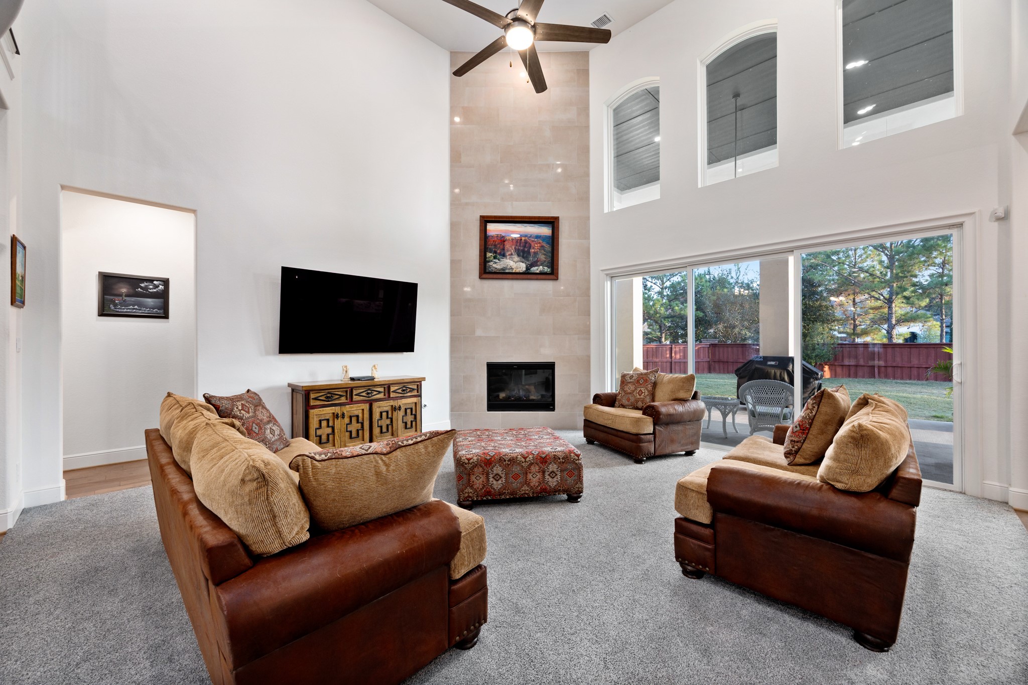 8538 Tynan Ridge Drive Magnolia, TX 77354 - Photo 26 of 50 a living room with furniture a flat screen tv and a fireplace