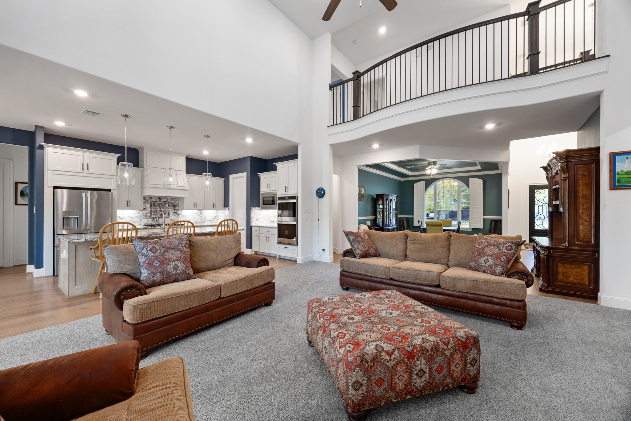 8538 Tynan Ridge Drive Magnolia, TX 77354 - Photo 28 of 50 a living room with furniture and a view of kitchen