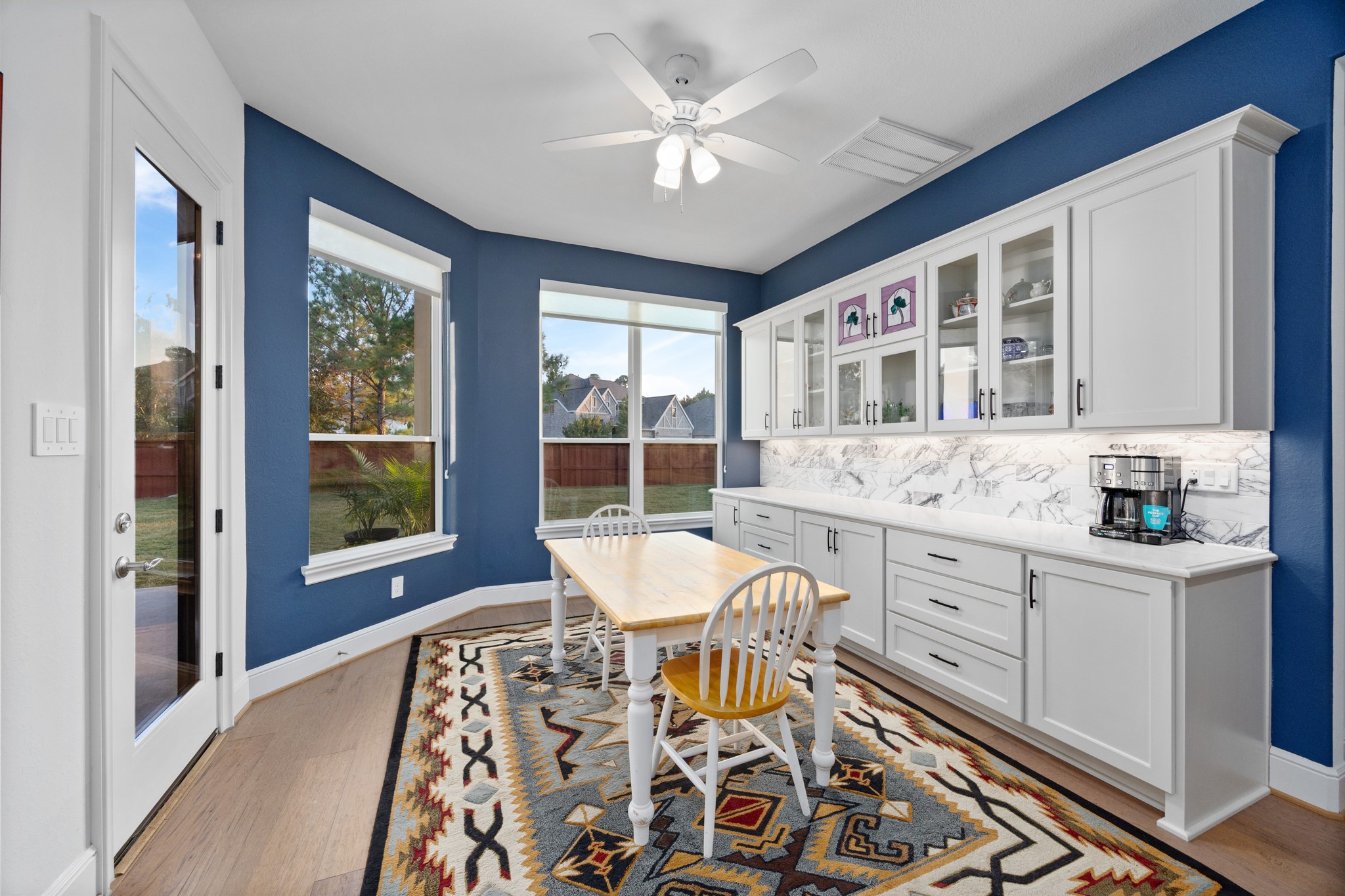 8538 Tynan Ridge Drive Magnolia, TX 77354 - Photo 33 of 50 a view of a dining room with furniture window and wooden floor