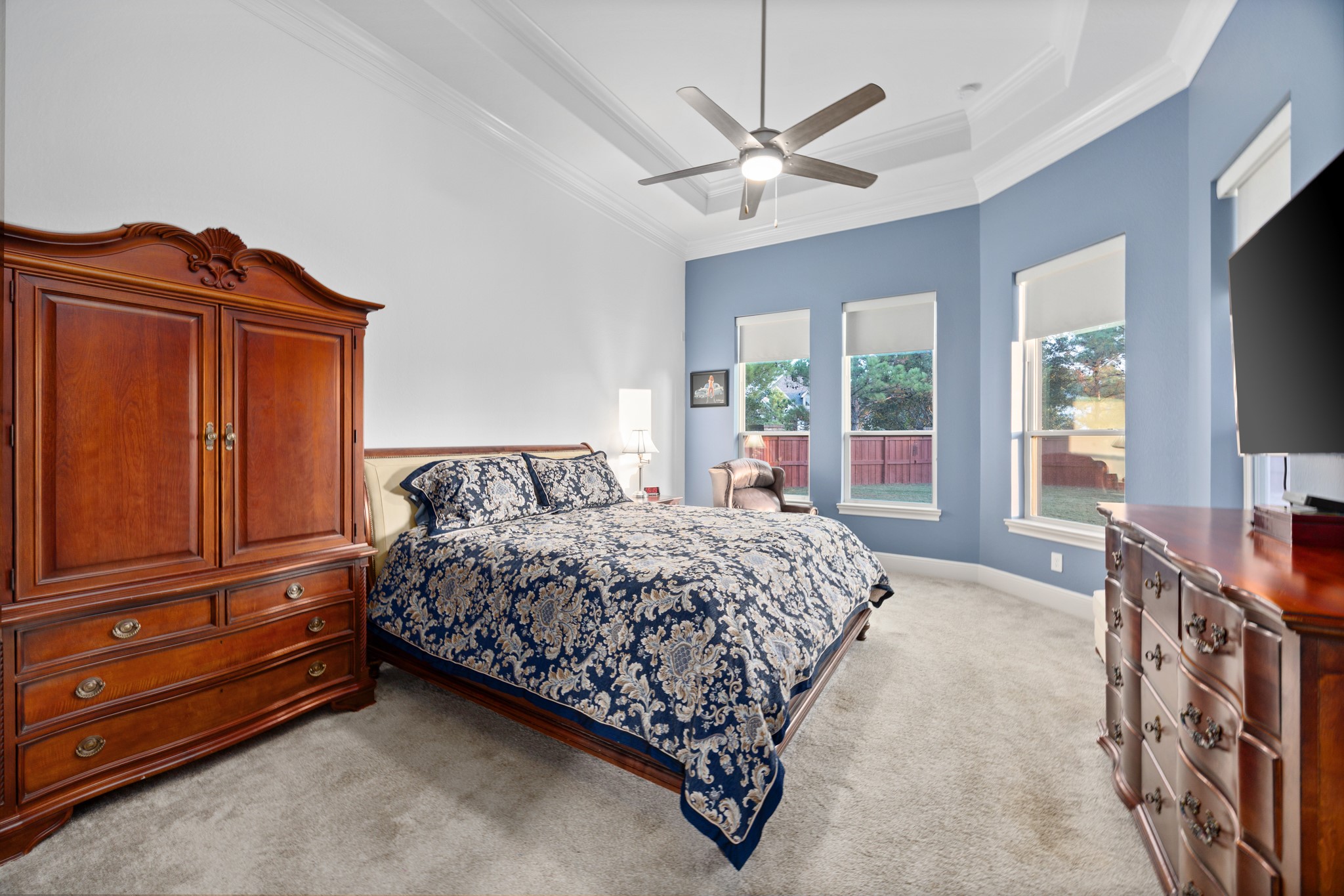 8538 Tynan Ridge Drive Magnolia, TX 77354 - Photo 37 of 50 a bedroom with a bed and a flat tv screen on dresser