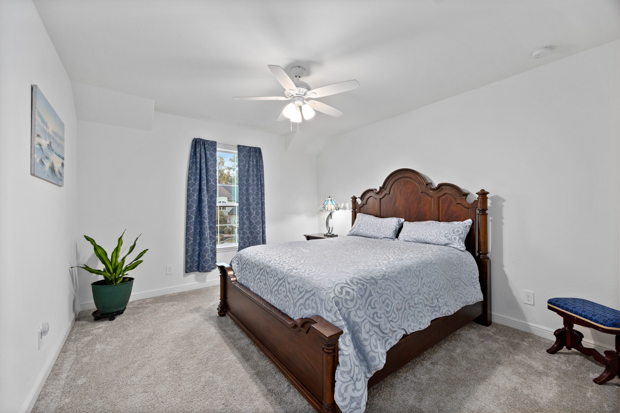8538 Tynan Ridge Drive Magnolia, TX 77354 - Photo 43 of 50 a bedroom with a bed and a potted plant