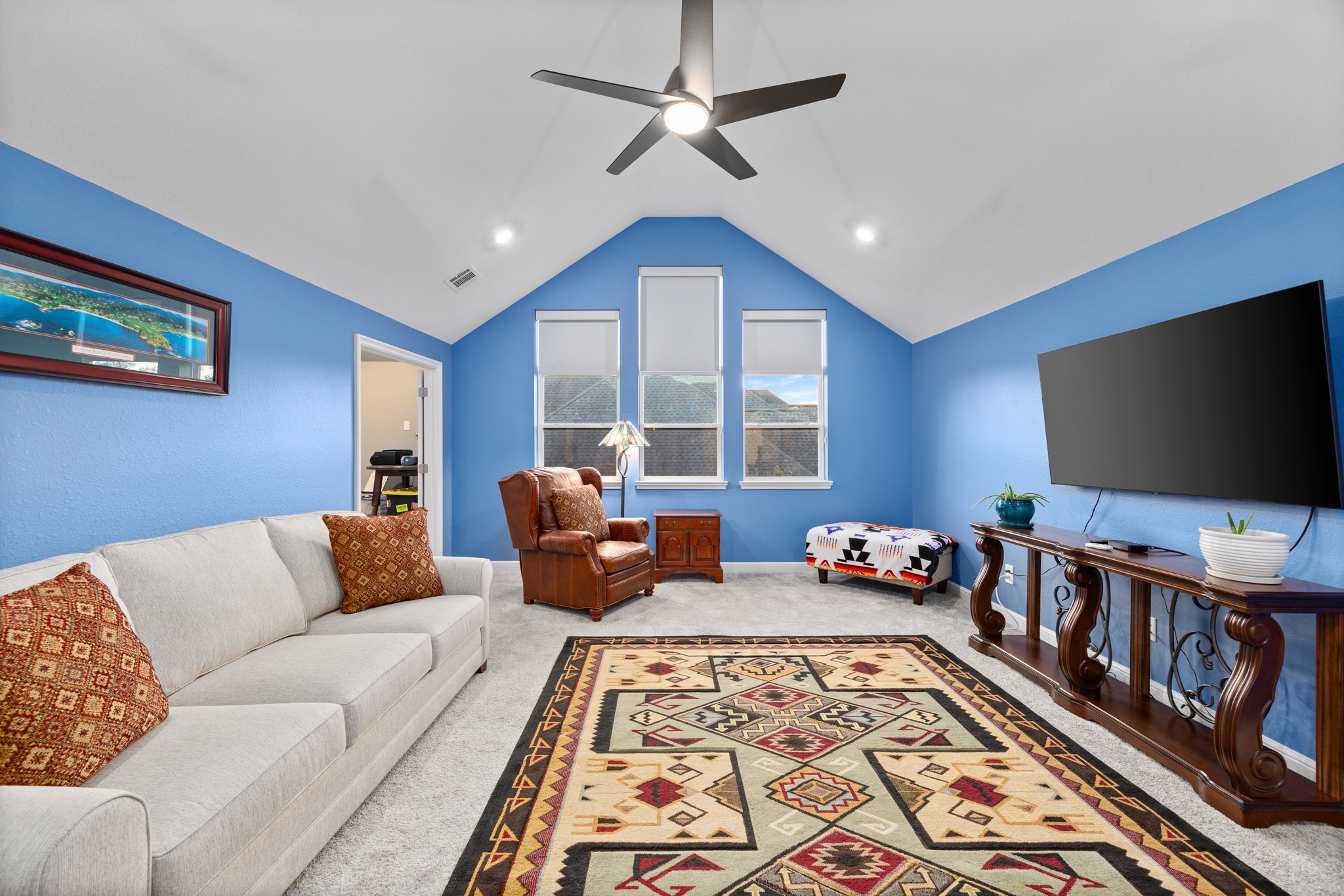 8538 Tynan Ridge Drive Magnolia, TX 77354 - Photo 46 of 50 a living room with furniture and a flat screen tv