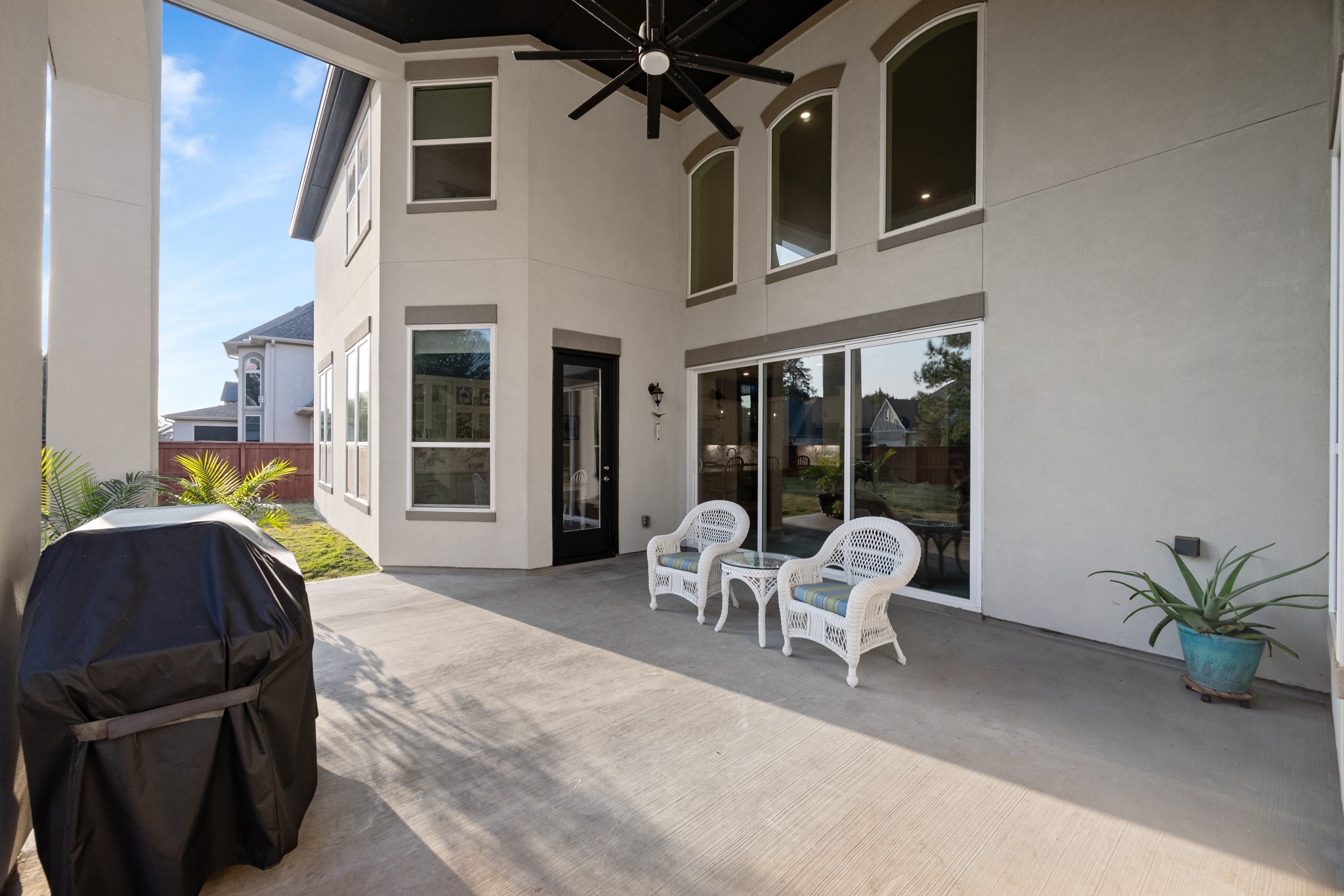 8538 Tynan Ridge Drive Magnolia, TX 77354 - Photo 9 of 50 a living room with furniture and large windows