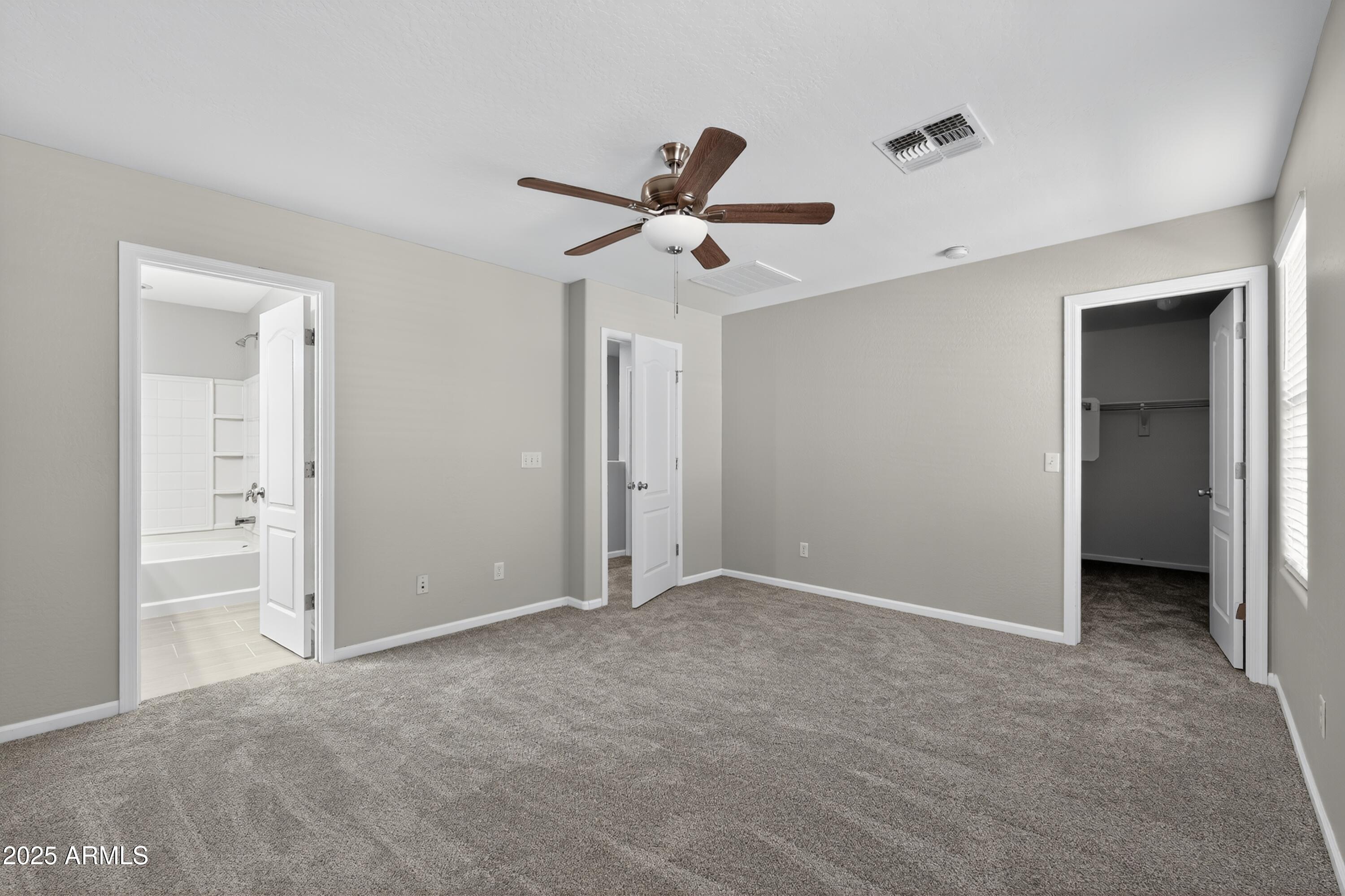 1250 South Rialto, Unit 31 Mesa, AZ 85209 - Photo 14 of 30 an empty room with closet and a ceiling fan