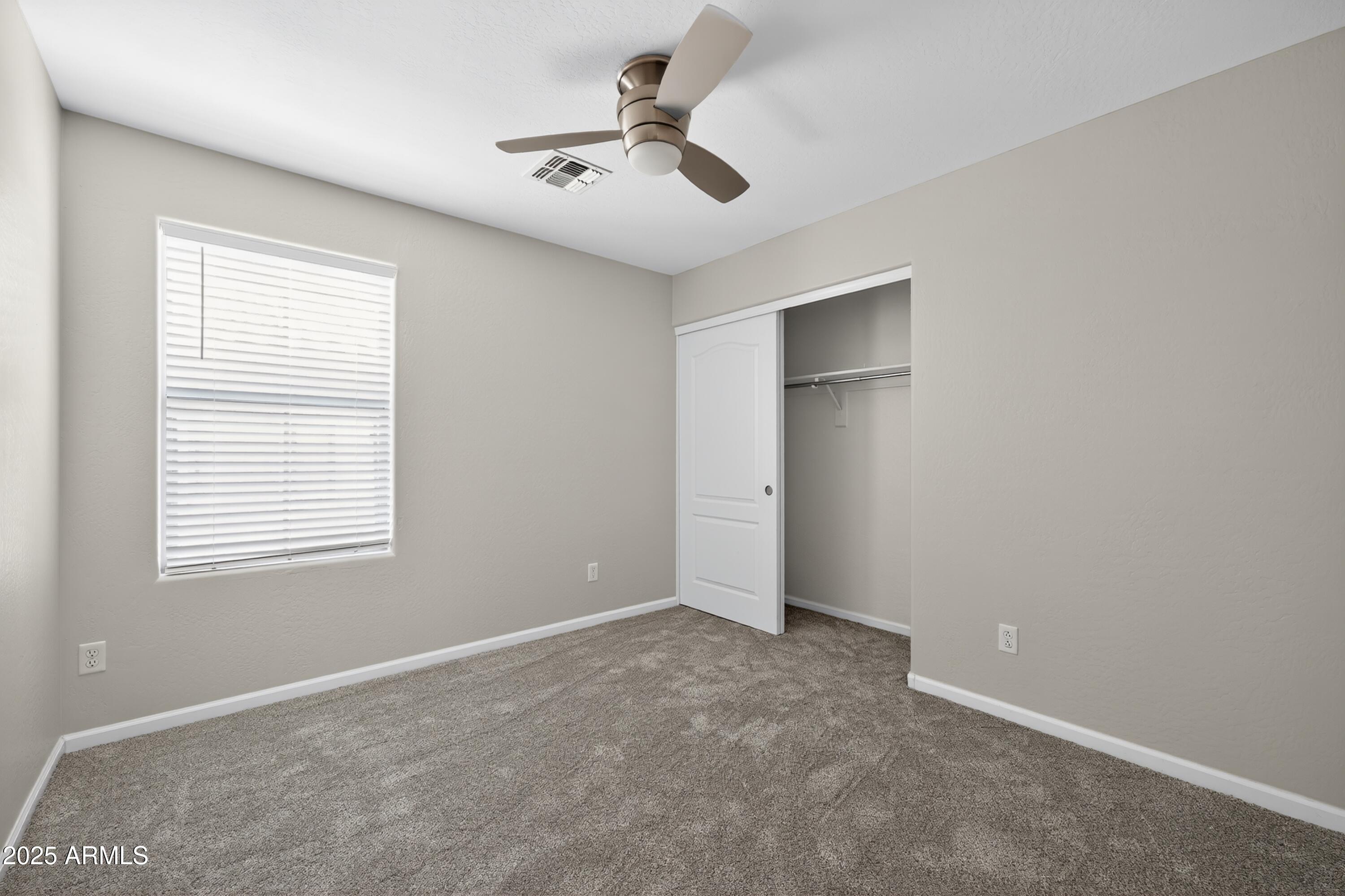 1250 South Rialto, Unit 31 Mesa, AZ 85209 - Photo 17 of 30 a view of an empty room with a window