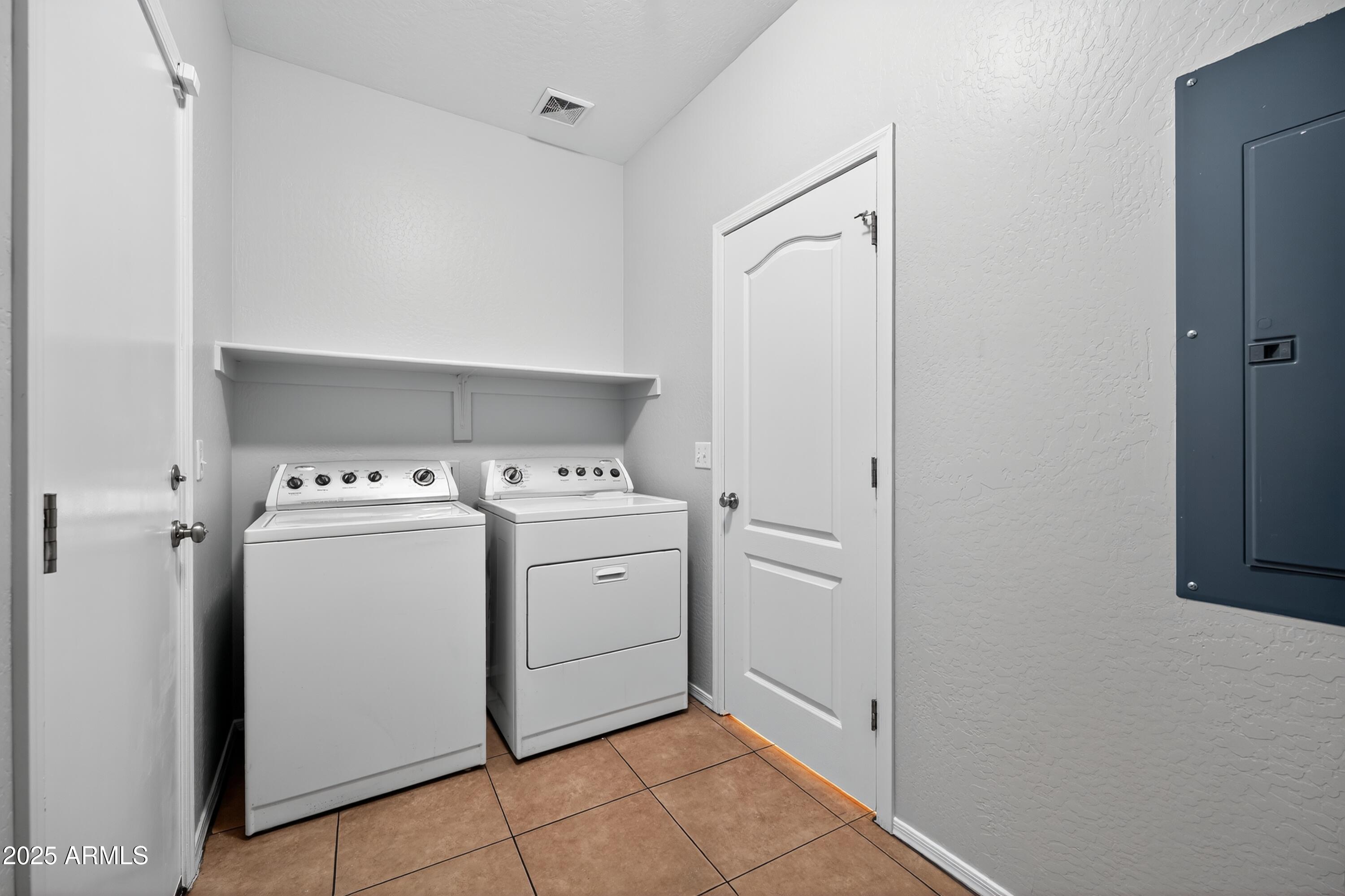 1250 South Rialto, Unit 31 Mesa, AZ 85209 - Photo 24 of 30 a utility room with dryer and washer