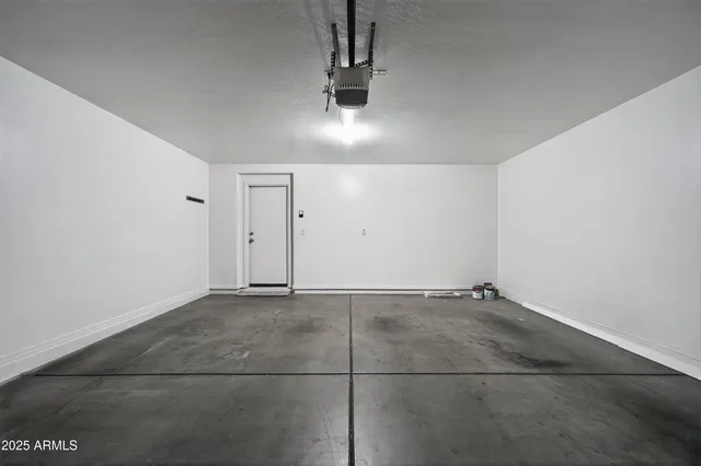 a view of a house with a yard and garage