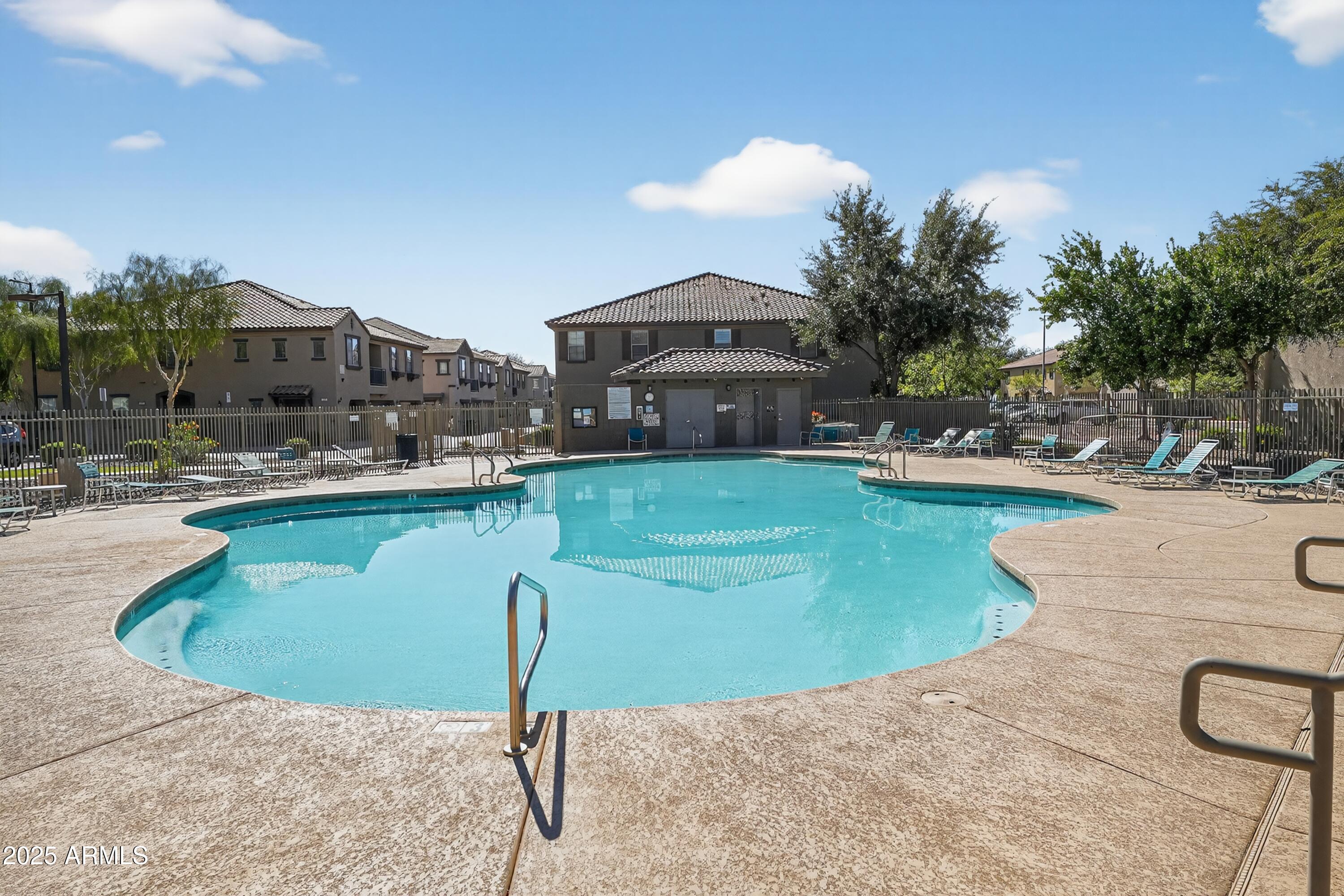 1250 South Rialto, Unit 31 Mesa, AZ 85209 - Photo 29 of 30 a swimming pool with outdoor seating and yard