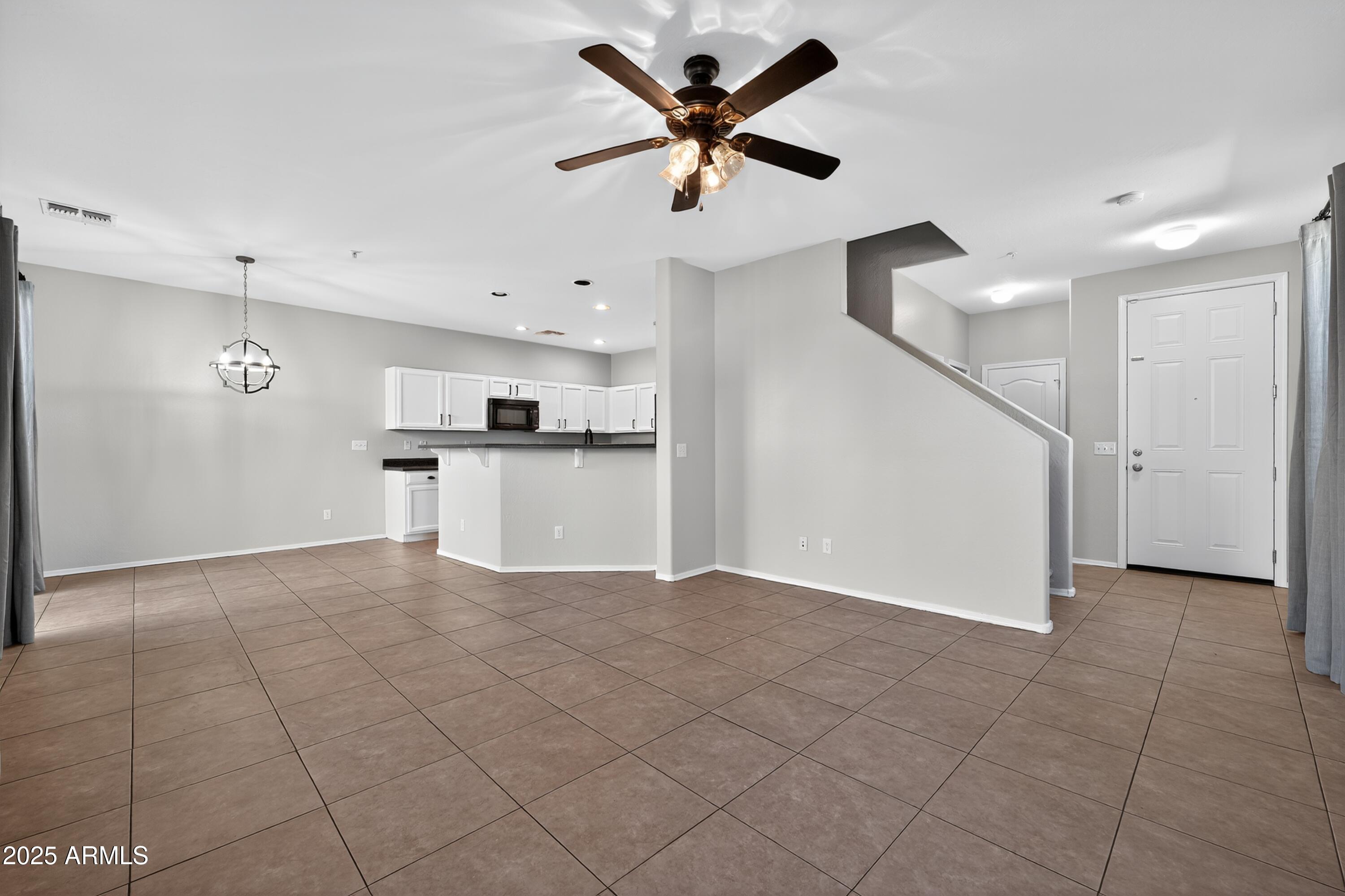 1250 South Rialto, Unit 31 Mesa, AZ 85209 - Photo 10 of 30 a view of a kitchen with a sink and a window