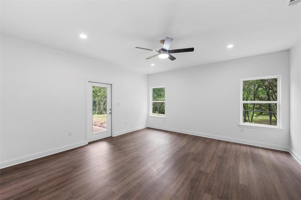 1698 Rogers Hill Road Waco, TX 76705 - Photo 14 of 40 Spare room with ceiling fan, recessed lighting, dark wood-type flooring, and baseboards