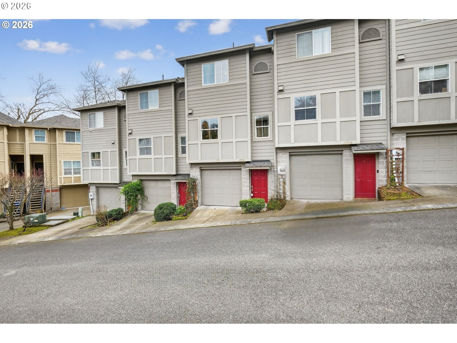 a view of a street with a building in the background