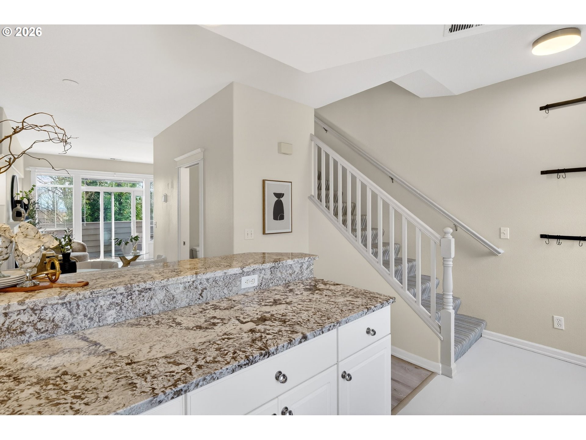 4934 Southwest 1st Avenue Portland, OR 97239 - Photo 15 of 33 a view of a hallway with wooden floor and staircase