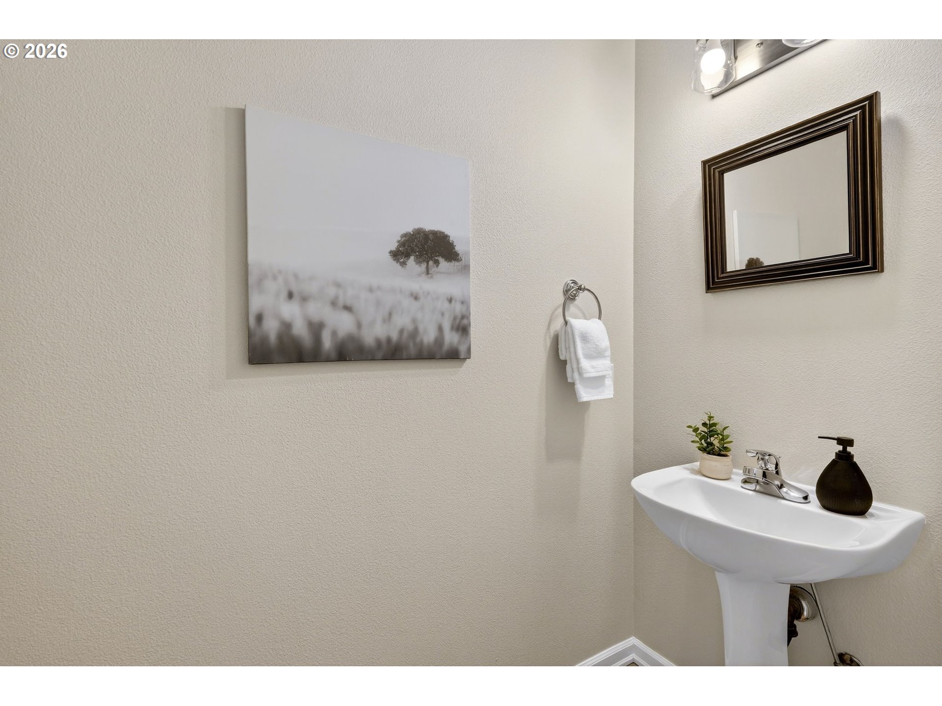 4934 Southwest 1st Avenue Portland, OR 97239 - Photo 16 of 33 a bathroom with a sink and a mirror