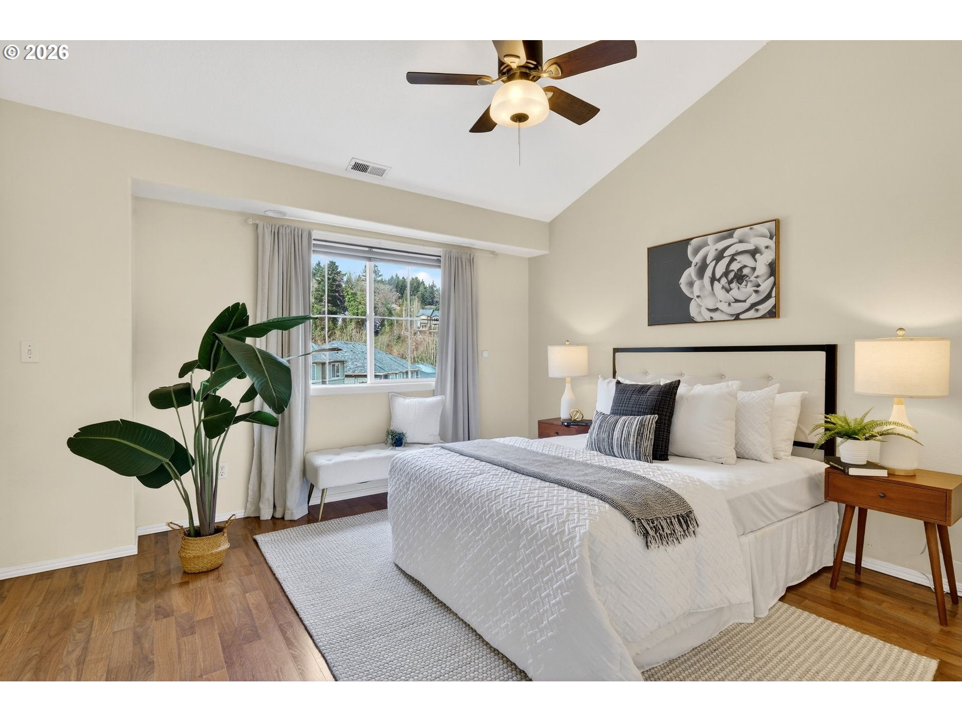 4934 Southwest 1st Avenue Portland, OR 97239 - Photo 18 of 33 a bedroom with a bed mirror and window