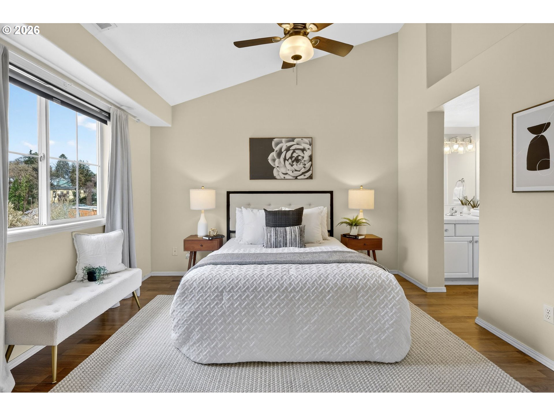 4934 Southwest 1st Avenue Portland, OR 97239 - Photo 19 of 33 a bedroom with a bed and window
