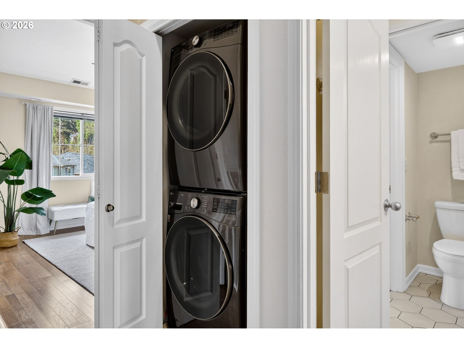 4934 Southwest 1st Avenue Portland, OR 97239 - Photo 25 of 33 a view of a hallway with washer and dryer