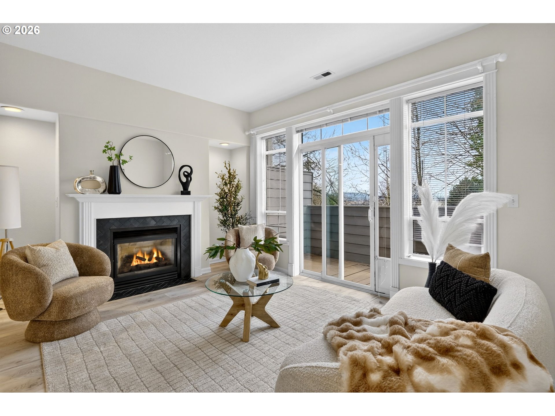 4934 Southwest 1st Avenue Portland, OR 97239 - Photo 3 of 33 a living room with furniture and a fireplace