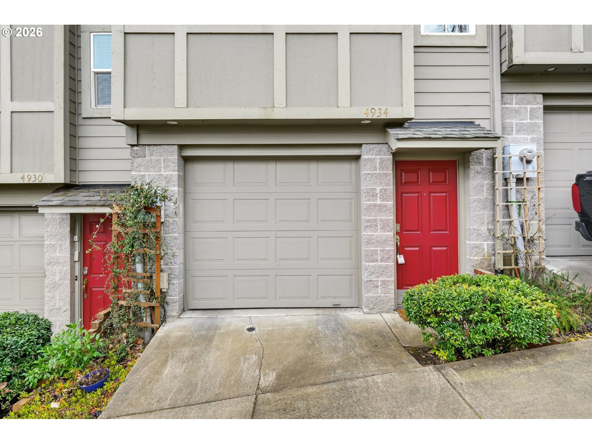 4934 Southwest 1st Avenue Portland, OR 97239 - Photo 31 of 33 a front view of a house with a garage