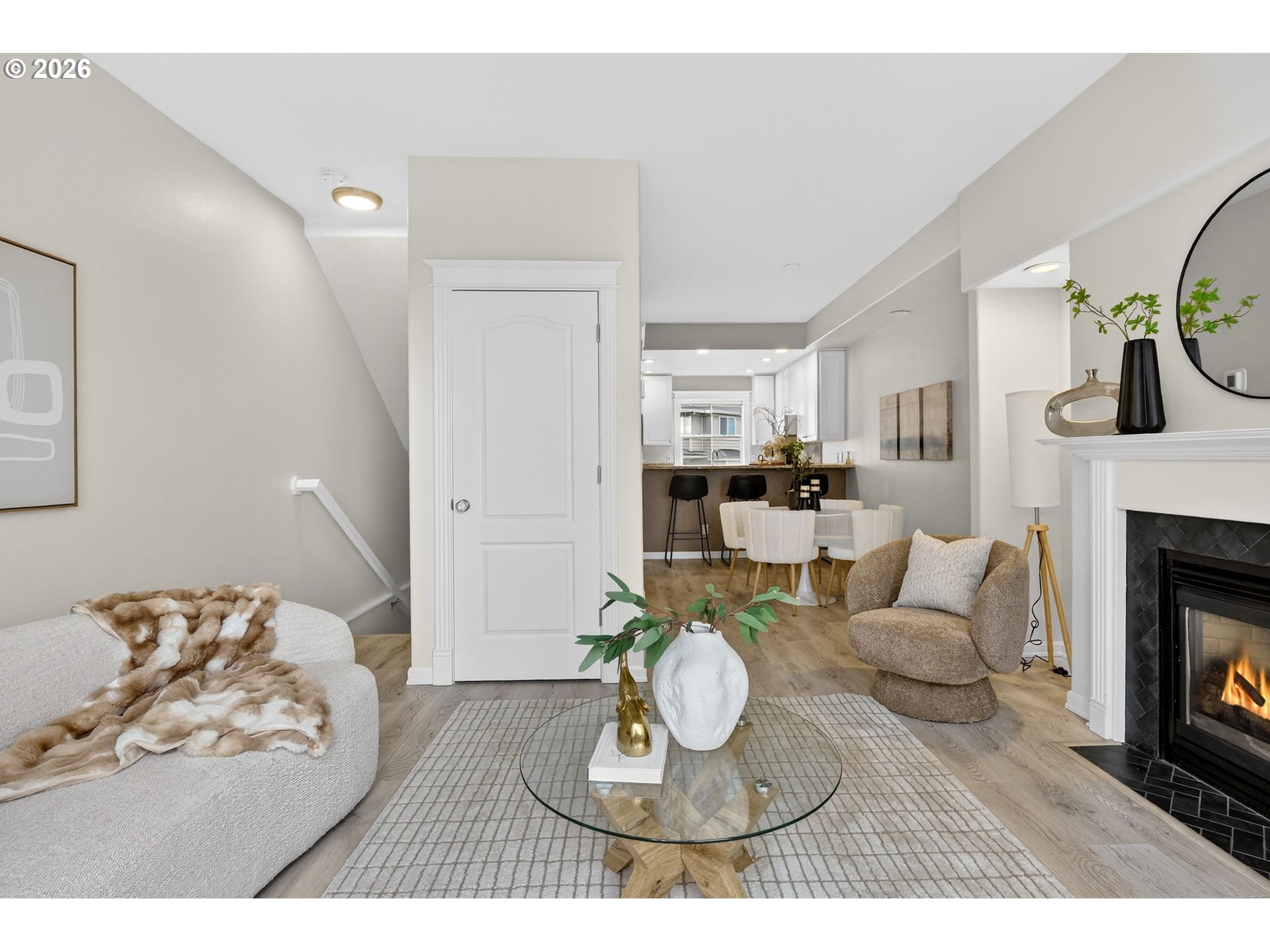 4934 Southwest 1st Avenue Portland, OR 97239 - Photo 5 of 33 a living room with furniture kitchen view and a fireplace