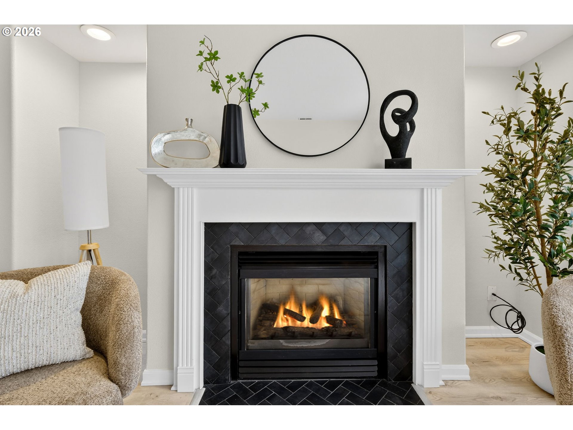 4934 Southwest 1st Avenue Portland, OR 97239 - Photo 6 of 33 a living room with a fireplace furniture and a potted plant