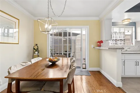 a kitchen with a table and chairs in it