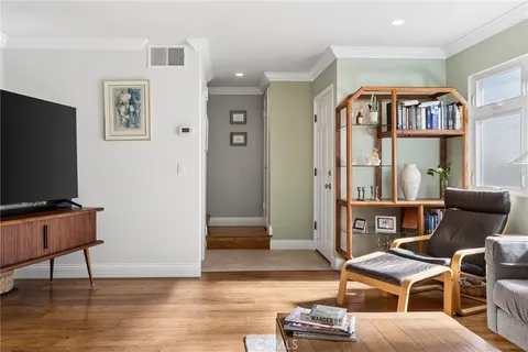 a view of a livingroom with furniture and a flat screen tv