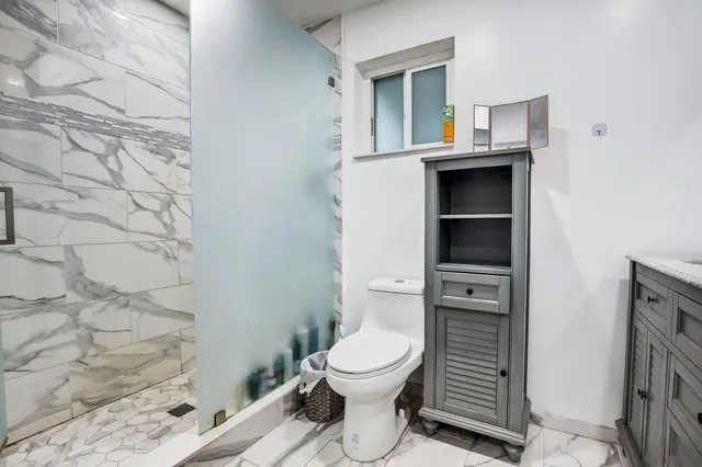 a bathroom with a toilet and a sink