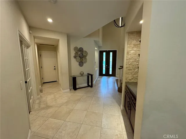 a kitchen with kitchen island granite countertop wooden cabinets and a stove