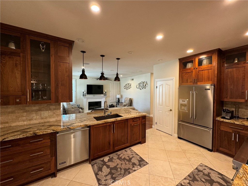 6 Lakeridge Rancho Santa Margarita, CA 92679 - Photo 26 of 75 a kitchen with stainless steel appliances granite countertop a sink stove and refrigerator