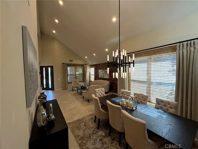 a spacious bedroom with a bed and large windows